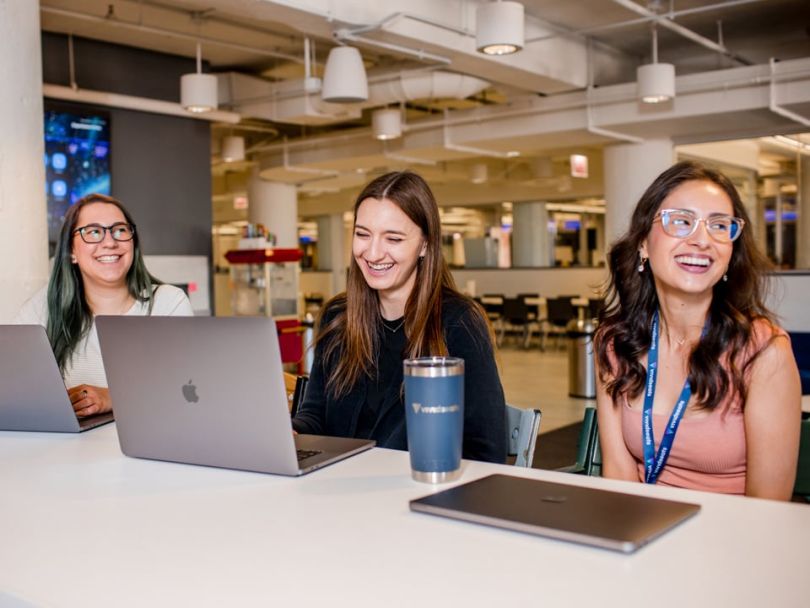 Vivid Seats team members working in the office