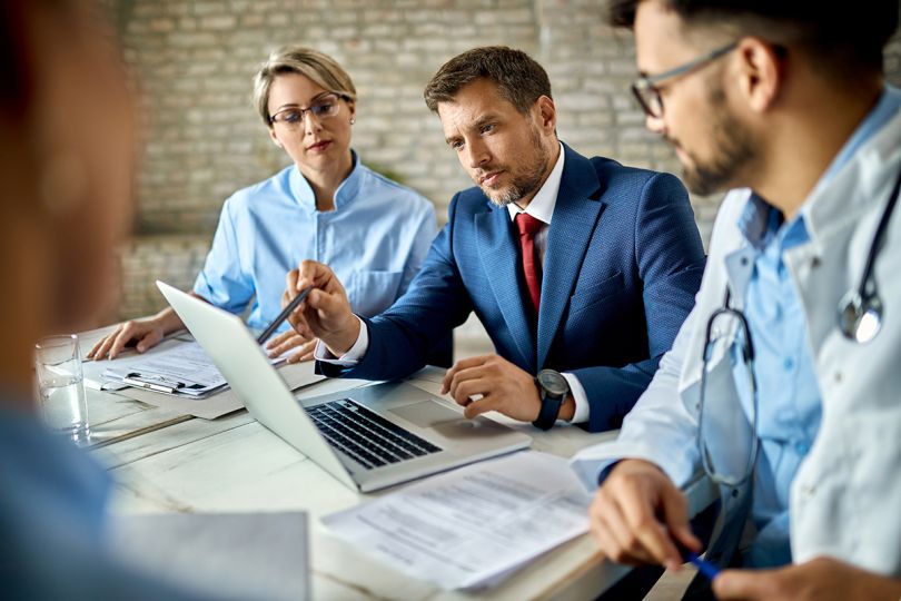 Businessman working on a laptop during a meeting