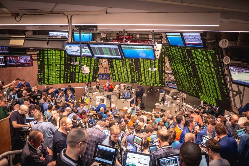 A group of Wolverine employees analyzing the financial market.
