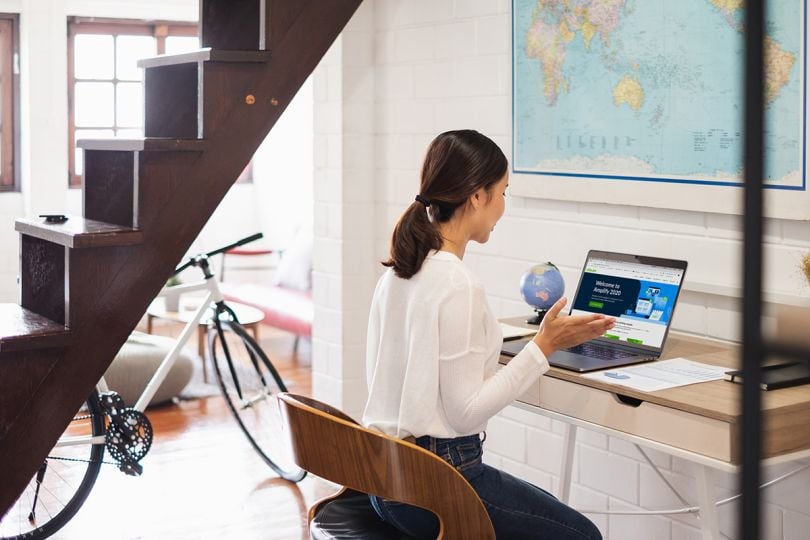 Woman working on a laptop from home