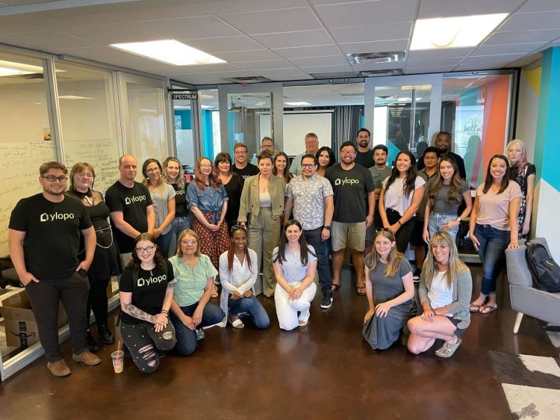 A group of Ylopo employees in the office.