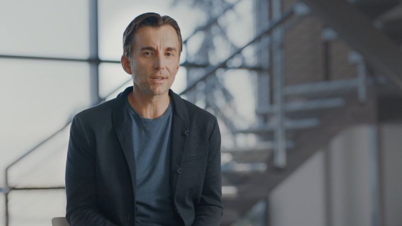 Qualtrics CEO Zig Serafin is pictured in an office.