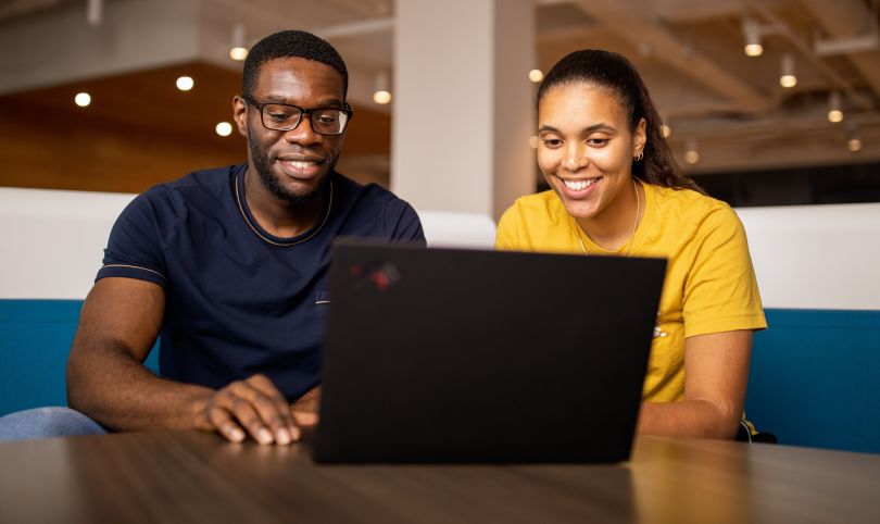 A picture of two Audible employees working