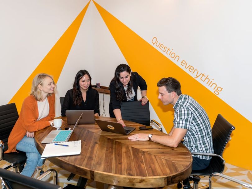 Earny's team collaborating in the office