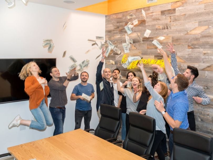 Earny's team celebrating in the office