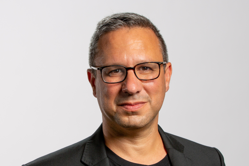 TripActions CEO Ariel Cohen poses for a photo