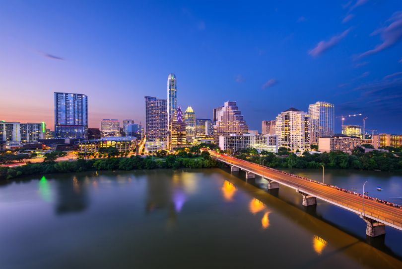A nighttime photo of the Austin skyline.