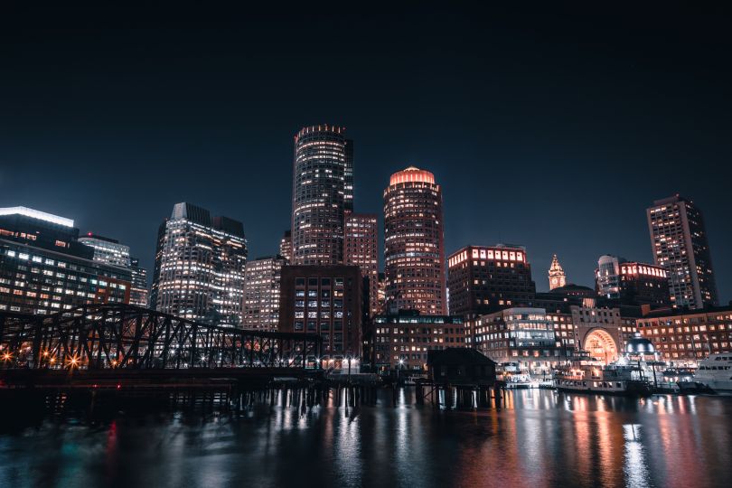 Boston skyline from the harbor at night.