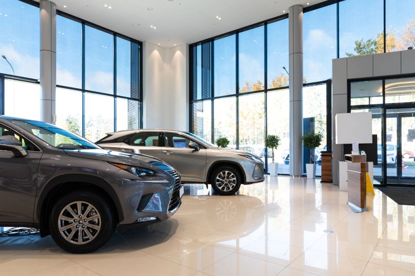 The interior of a car dealership is pictured.