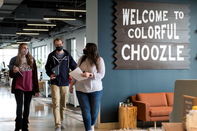 coworkers walking down a hall