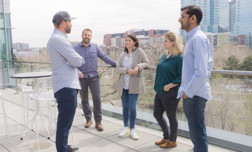 CometChat co-founder Anant Garg talks with CometChat employees.
