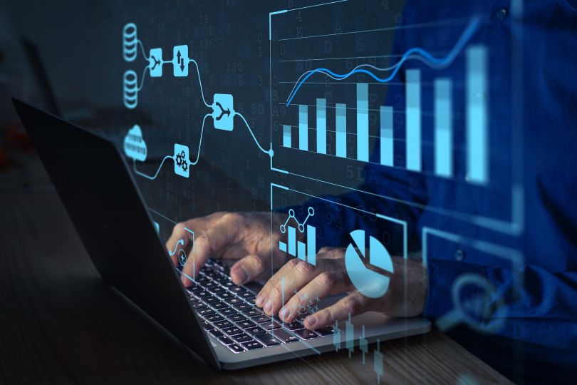 A person is depicted analyzing data.
