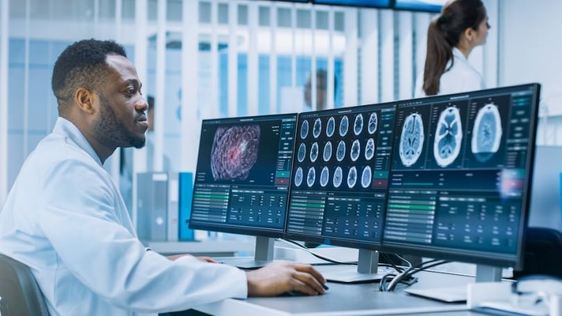 Medical scientist conducting research on a computer