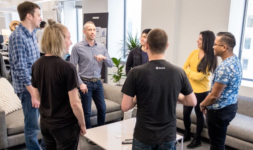 Tech team at dscout standing in a circle and chatting