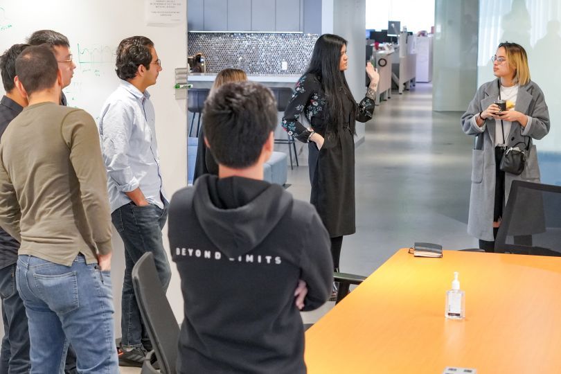 A group of Beyond Limits employees listening to a presentation.