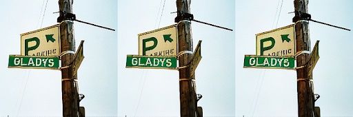 Three parking sign images generated with Stable Diffusion. ft-EMA (left), ft-MSE (middle), original (right)