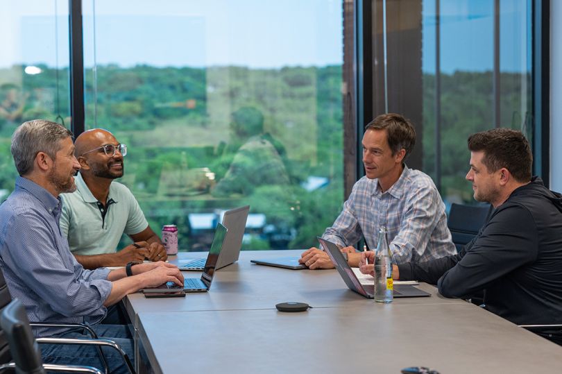 AlertMedia team members having a meeting