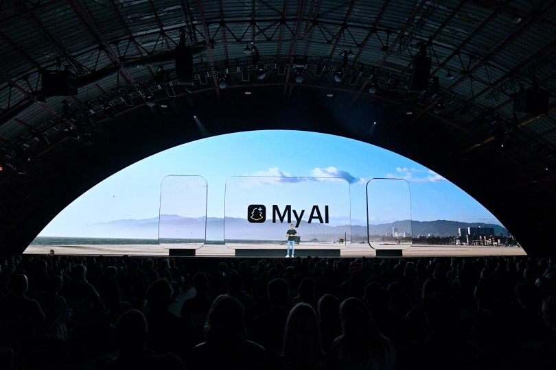  Photo of keynote stage at Barker Hangar with "My AI" on the large, semicircle screen