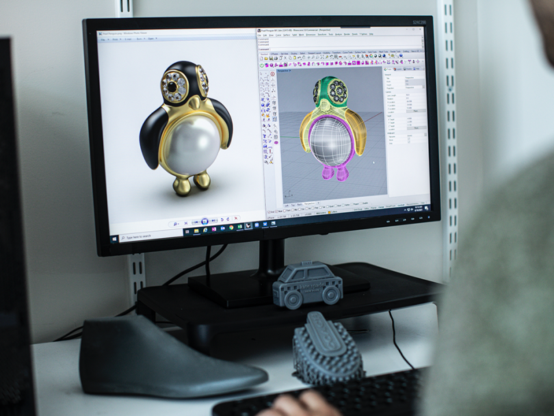 Someone working at a computer monitor digitally designing products