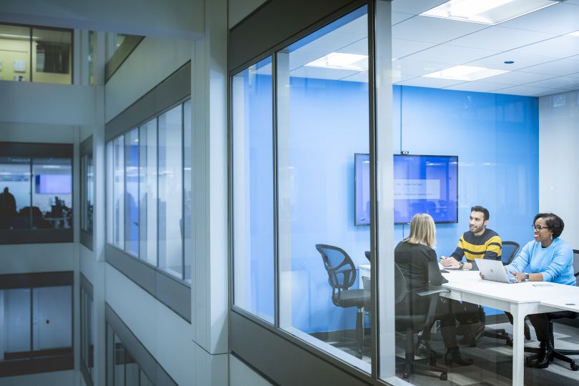 Clearcover employees meet in an office setting