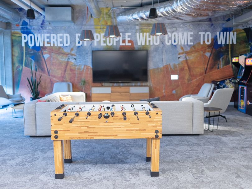 recreational room at CDM's office with foosball table and TV