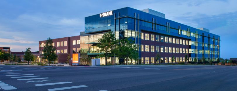 Exterior photo of FirstBank’s corporate headquarters at dusk.&nbsp;