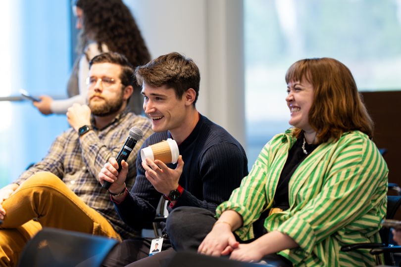 a group of interns laughing at a Chamberlain Group event