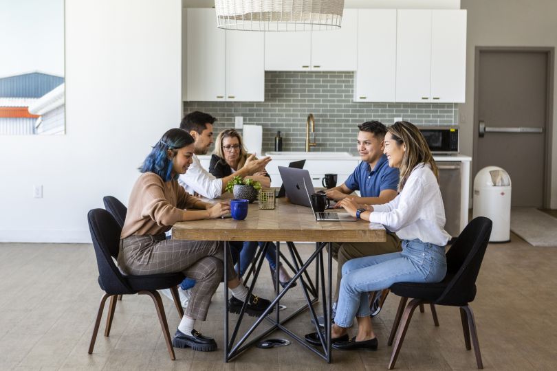 Jointly team working at a table.