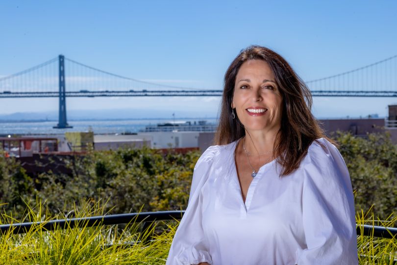 VP of Talent Yvette Kamperin portrait outside with bridge in background