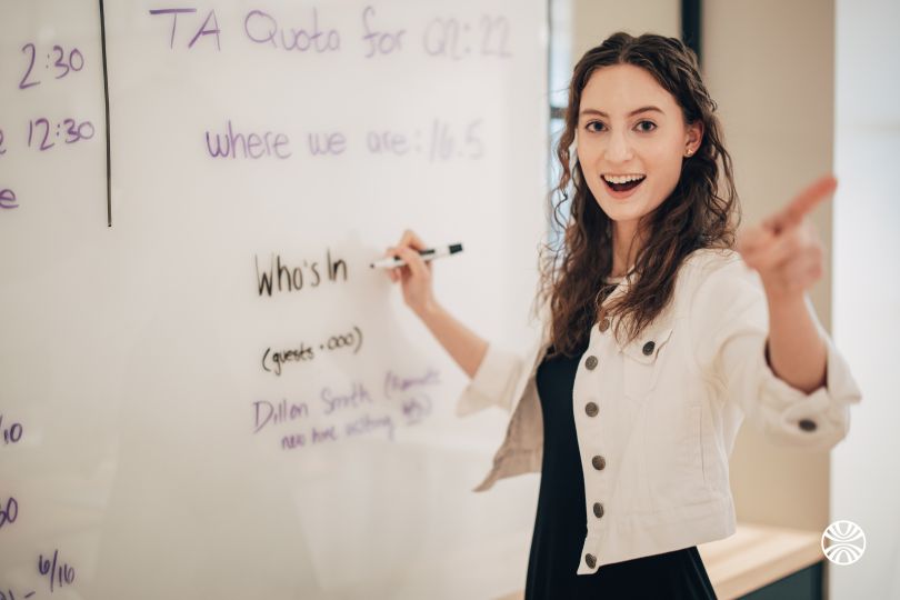 A Mirakl team member takes notes on a whiteboard in the company’s office