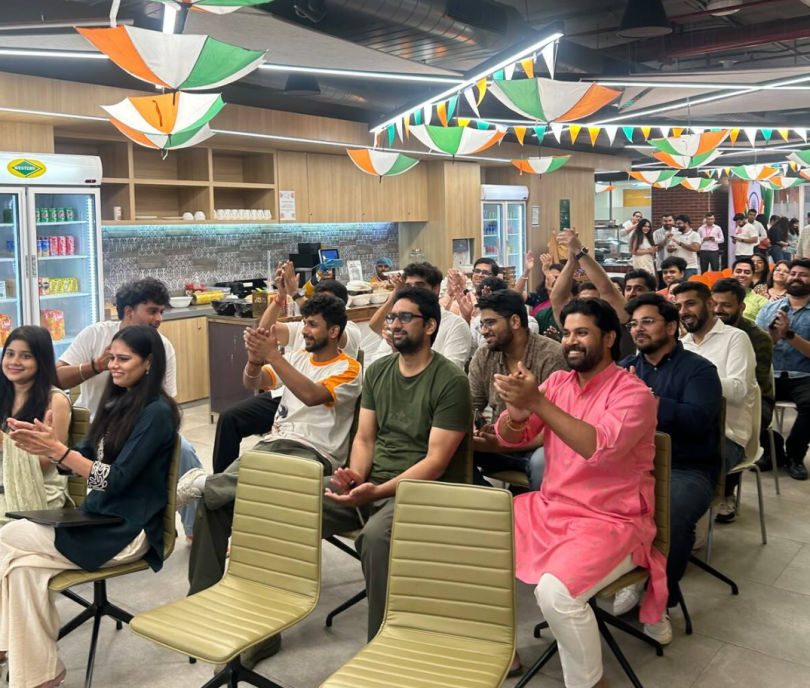 MongoDB employees clap their hands during an office celebration in India