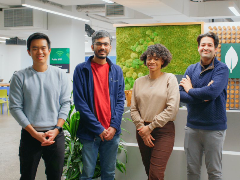 Four MongoDB team members pose for a group photo in the company’s office