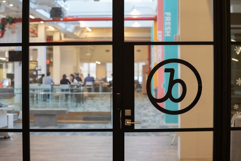 Braze's logo on a glass office door