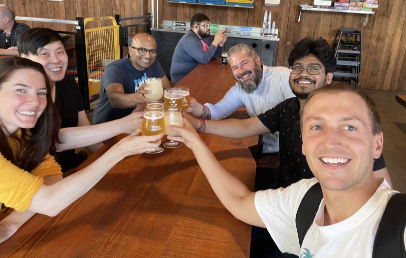 Pebble coworkers share a drink. 