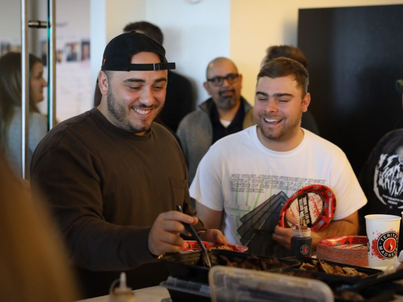 PrizePicks team members enjoying catered lunch together&nbsp;