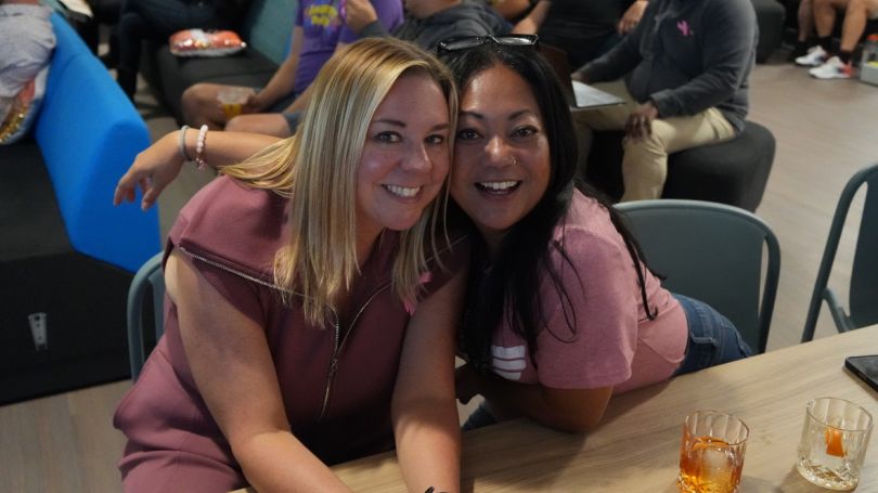 Micayla Evers and Rozlyn Ramirez pose for a photo during a company event