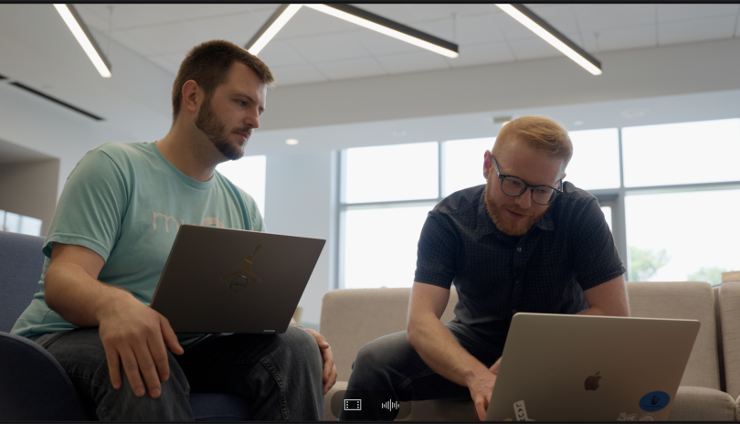 Engineers look at their computers