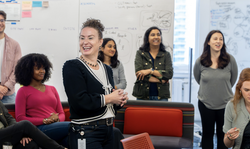 Grainger employees chatting in a work setting. 