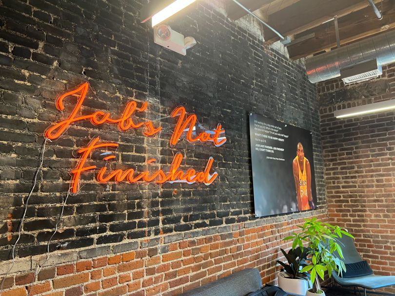 Vorto office wall with decorative signage reading “Job’s Not Finished”&nbsp;