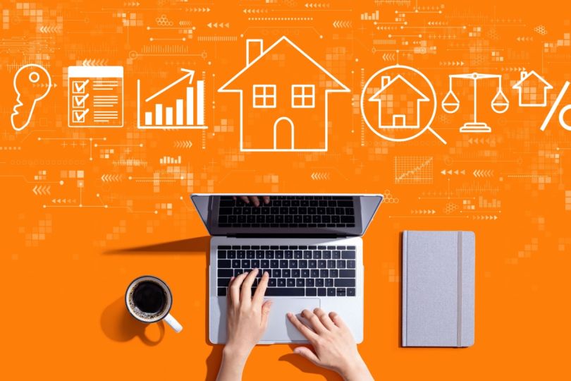 A laptop with an array of business and home-related icons.&nbsp;