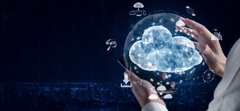 A hand hovers over icons related to cloud and network technologies.&nbsp;