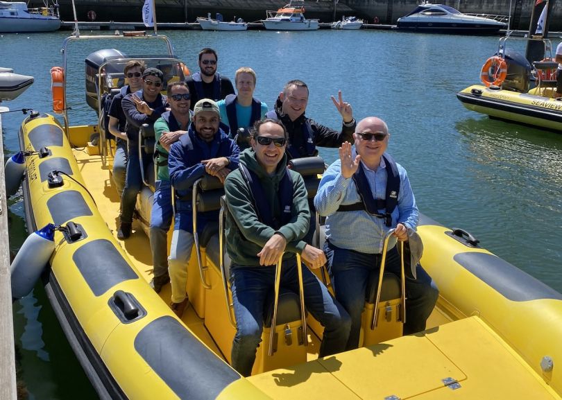  Liftoff team members enjoy a boat ride on a company outing.&nbsp;