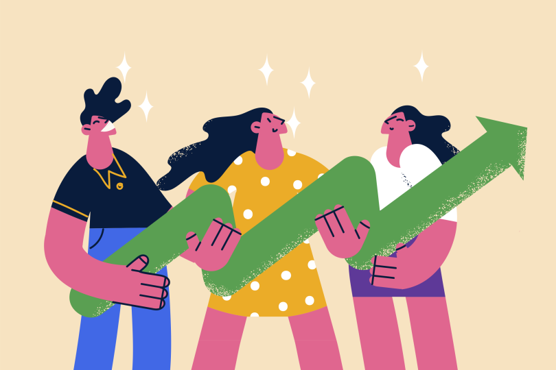three people carrying a giant growth symbol together
