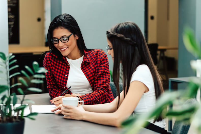 Interns working on a paper