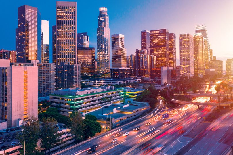 Downtown Los Angeles next to the expressway during sunset.