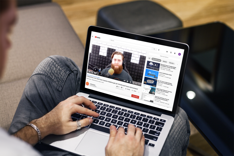 Chase Dovey's training lesson video plays on a laptop