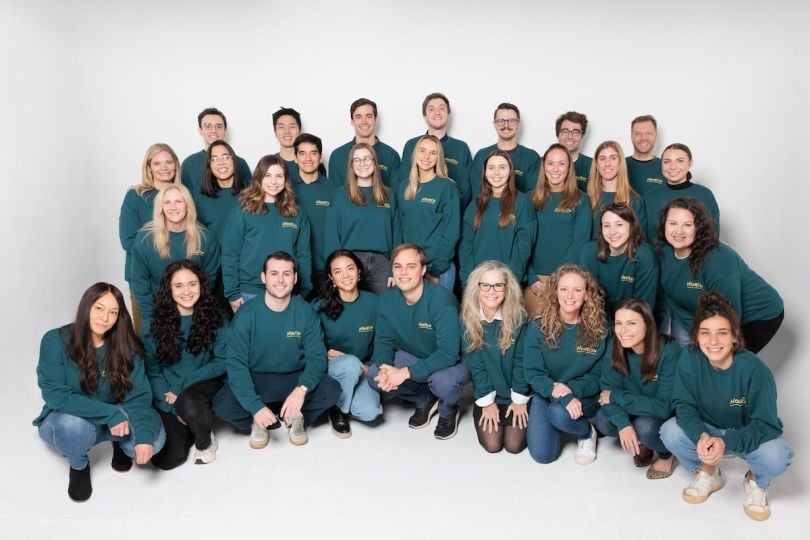 Nourish team members pose for a group photo in matching sweatshirts.&nbsp;