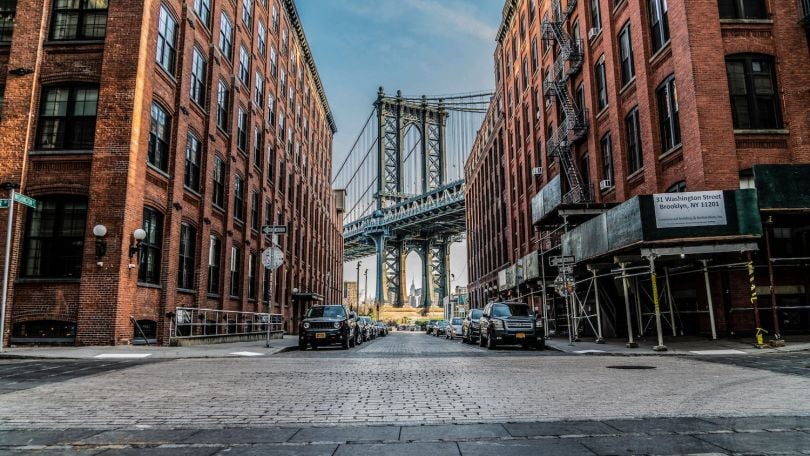 A view of the Brooklyn Bridge through two buildings
