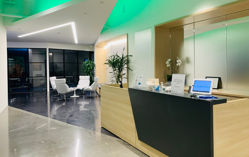 A greeting desk and seating area at Cloudvirga's office space.