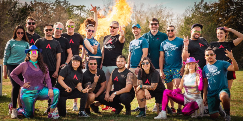 StellarFi’s staff pose for a group photo outside. 